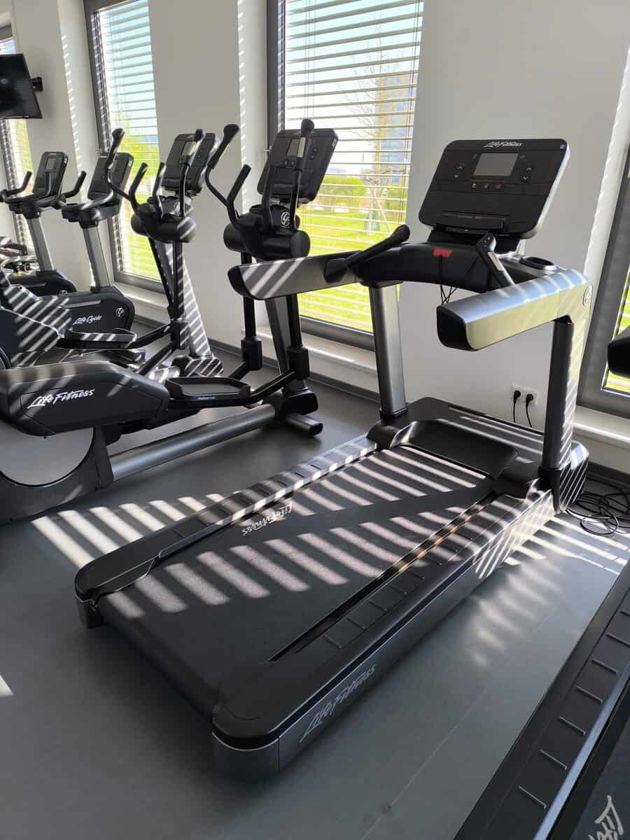 Gym Service technician repairing commercial fitness equipment
