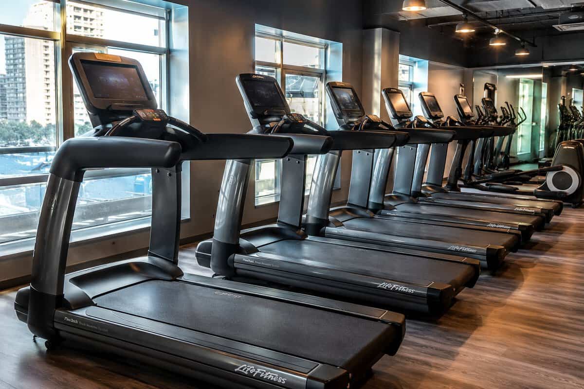 Commercial treadmills in a modern fitness club cardio area